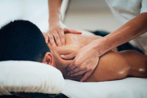 physical-therapist-massaging-shoulder